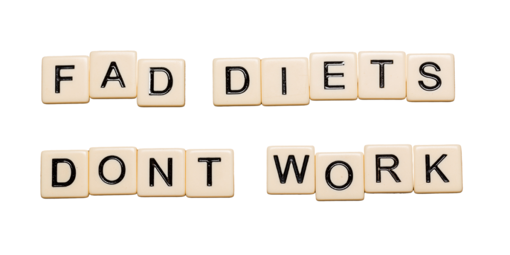 the words fad diets dont work spelled out in scrabble pieces