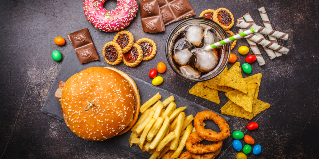 a table full of junk food showing an example of unhealthy snacking