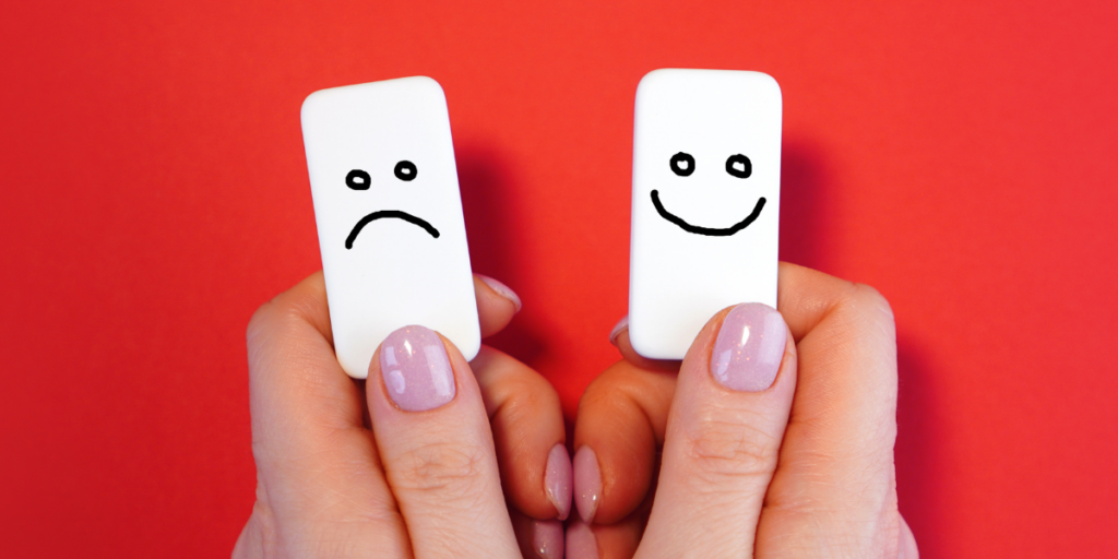 happy face frown face on two dominoes showing moods with hormone disruptors